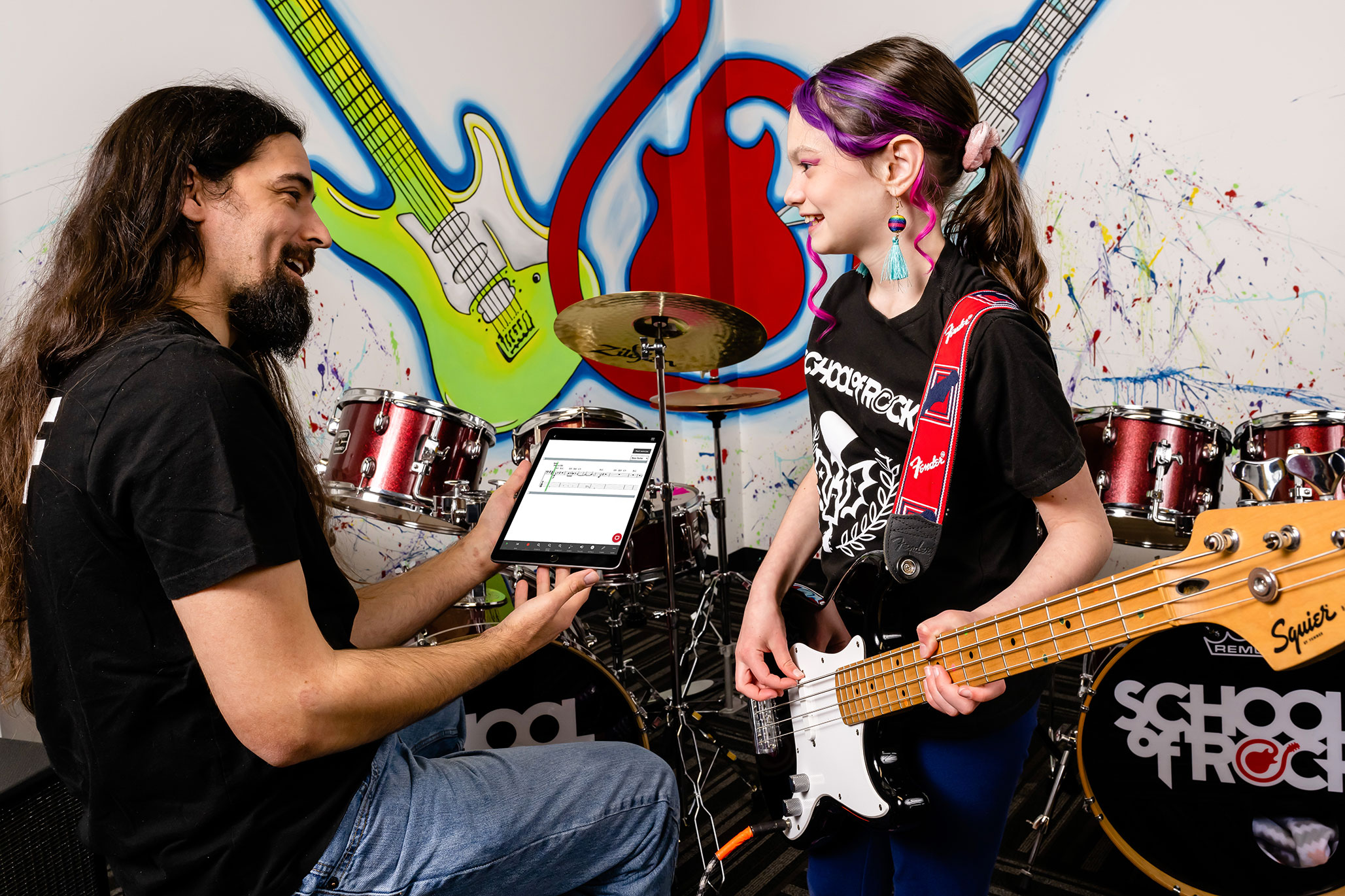 School of Rock students learn theory and techniques via songs from legendary artists such as Aretha Franklin, Lenny Kravitz, and Led Zeppelin.