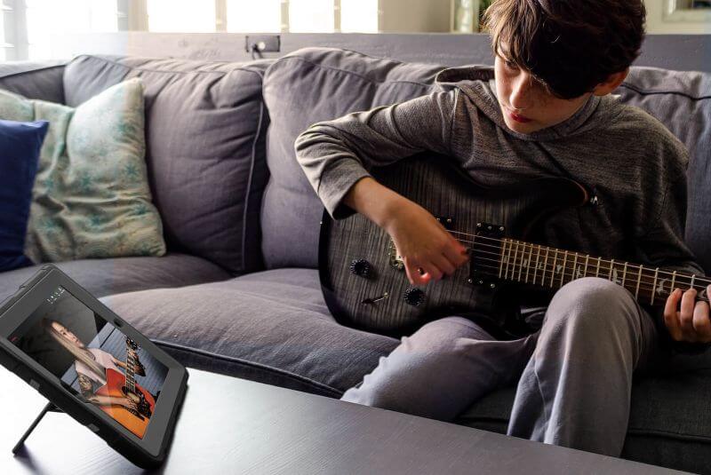 School of Rock student learning guitar from home