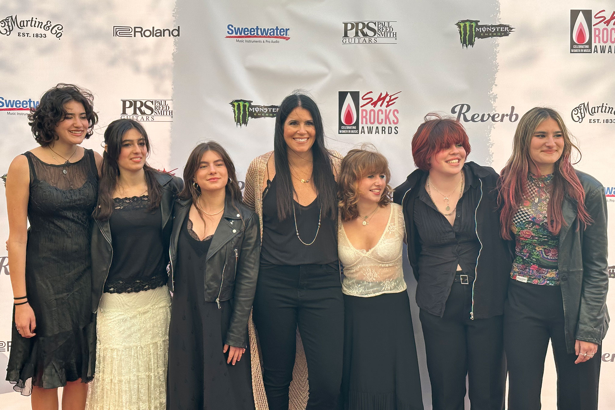 School of Rock COO Stacey Ryan with students from School of Rock West LA on the 2023 She Rocks Awards red carpet