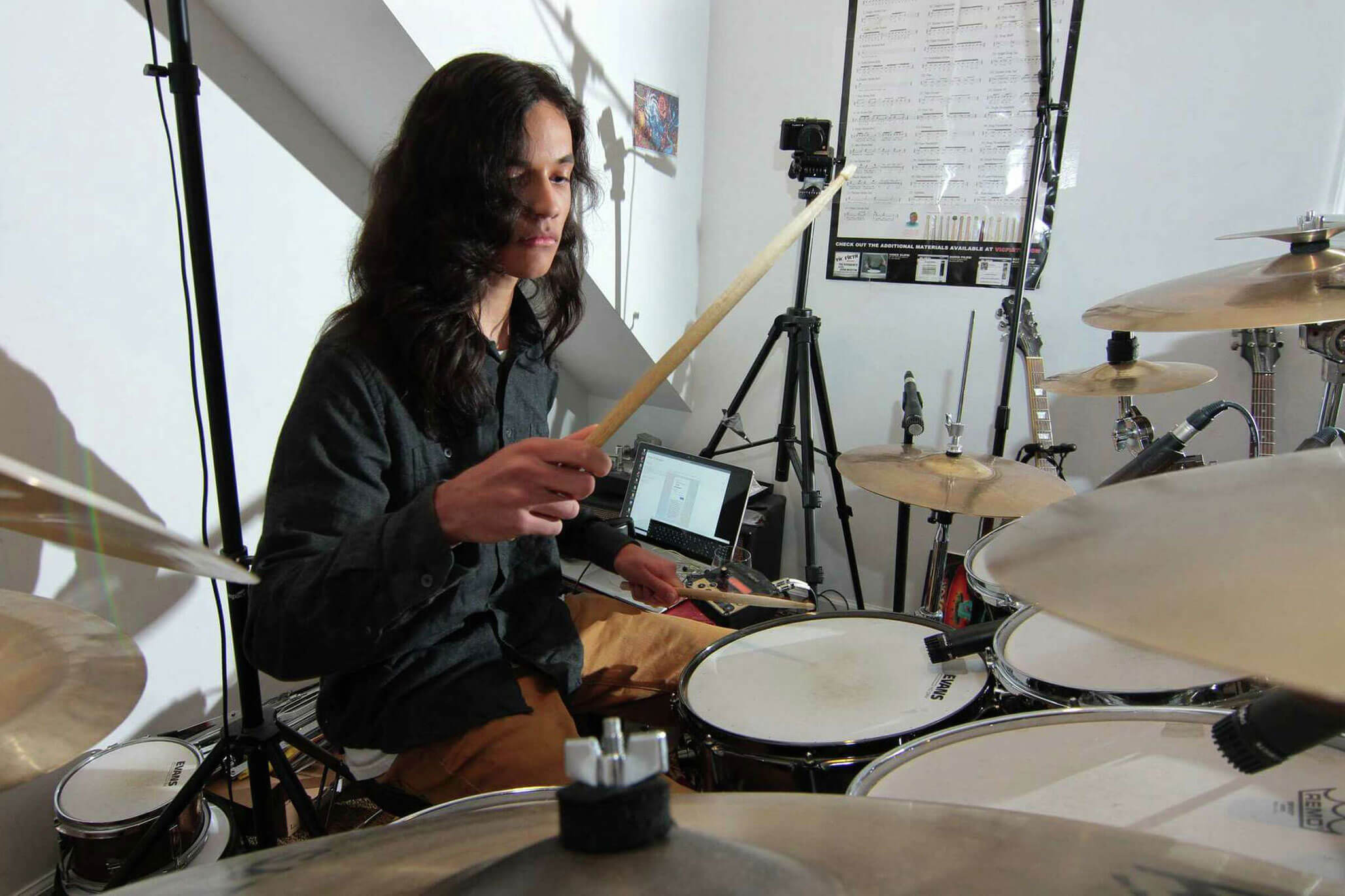 Musician Nikhil Talwalkar, 17, plays drums in his home studio in Darien, Connecticut