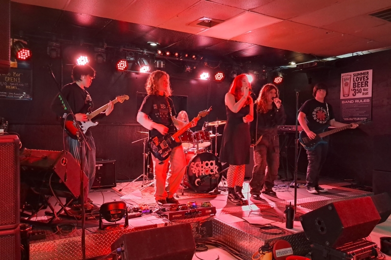 Students perform on stage