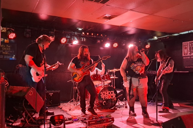Teachers perform on stage