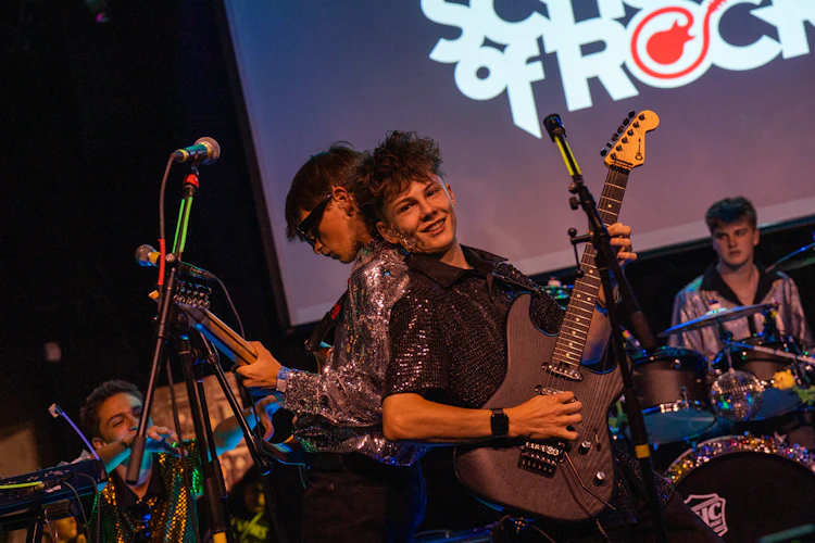 School of Rock Students Performing on Stage