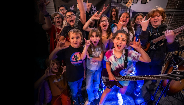 After-school music students in School of Rock's Rock 101 program gathering before band rehearsal
