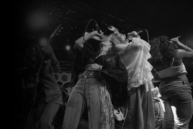 Students on stage performing together with confidence