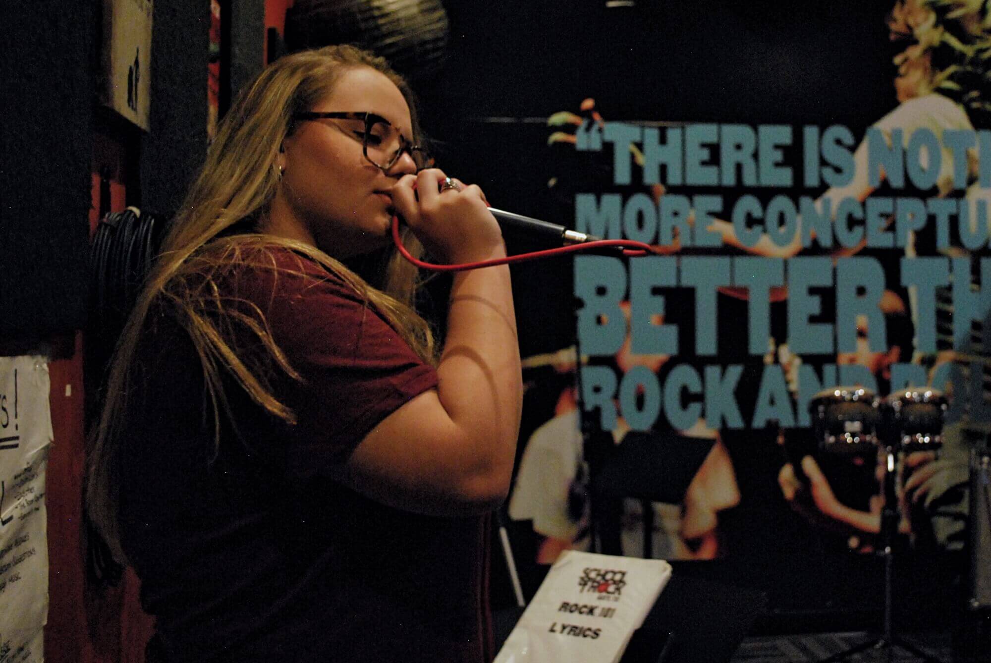 A House Band member works on her vocals during a recent rehearsal.