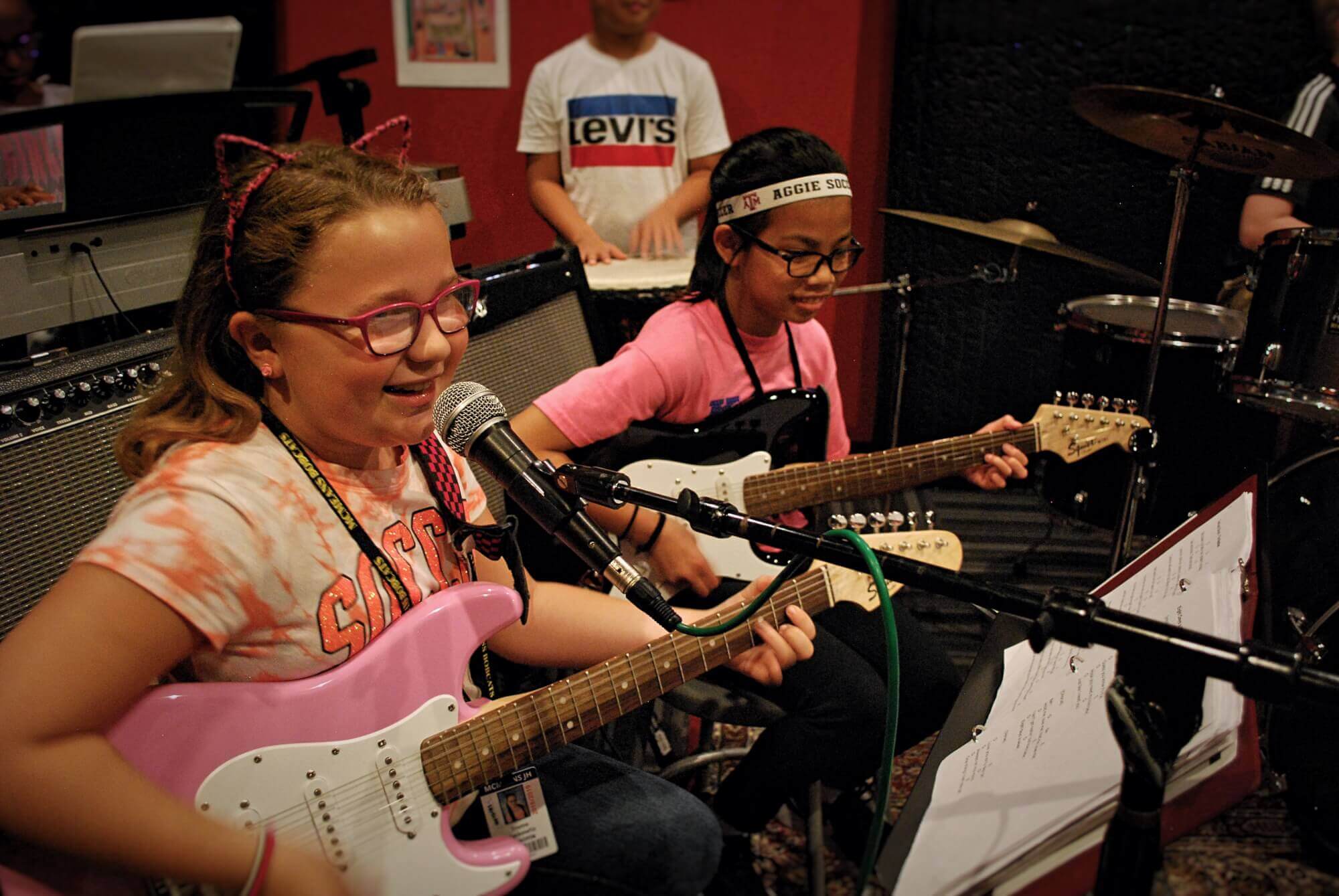 Rock 101 students enjoy working with their bandmates on their new songs.