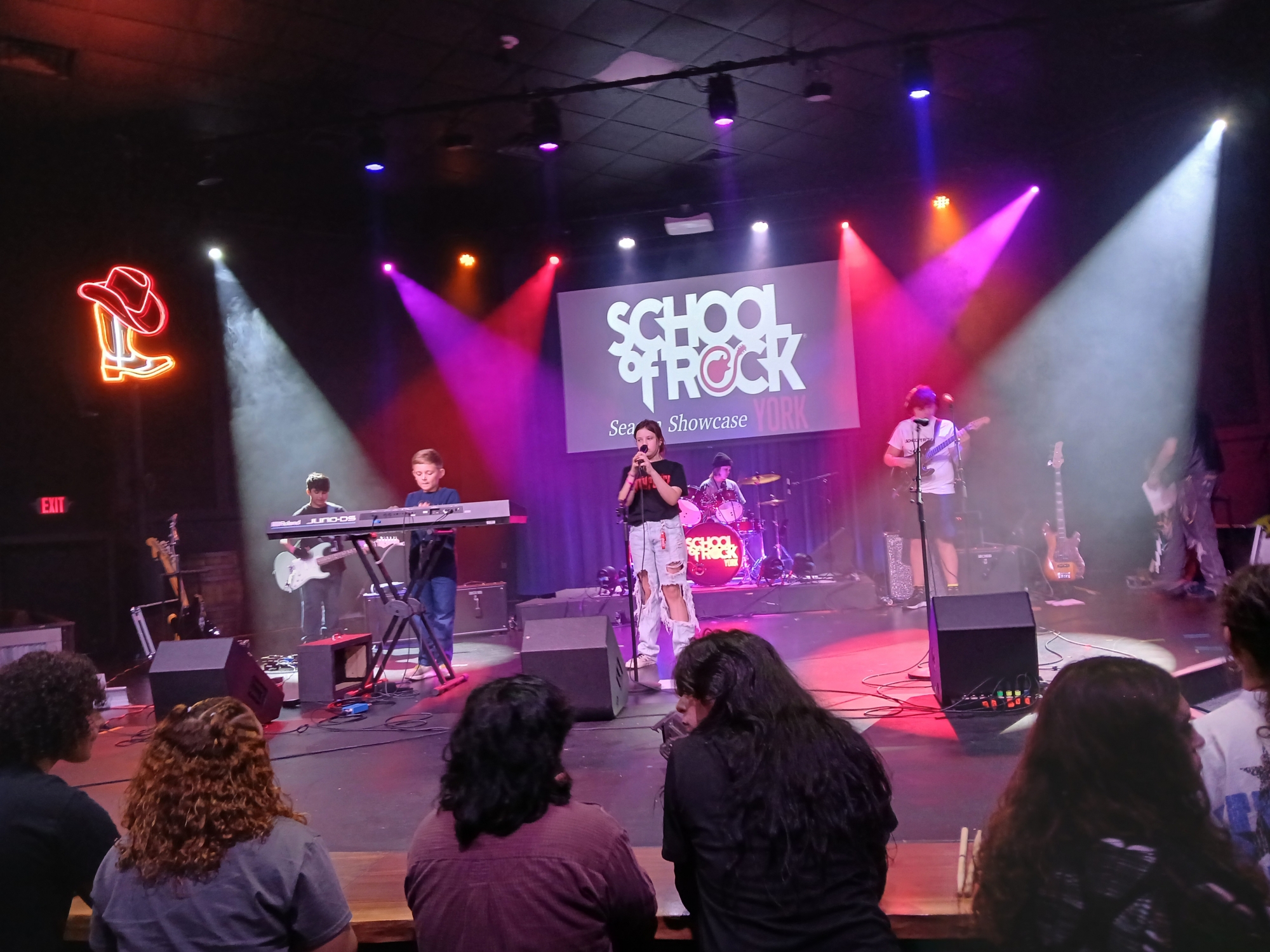 Learn to play live on stage with others at School of Rock York.