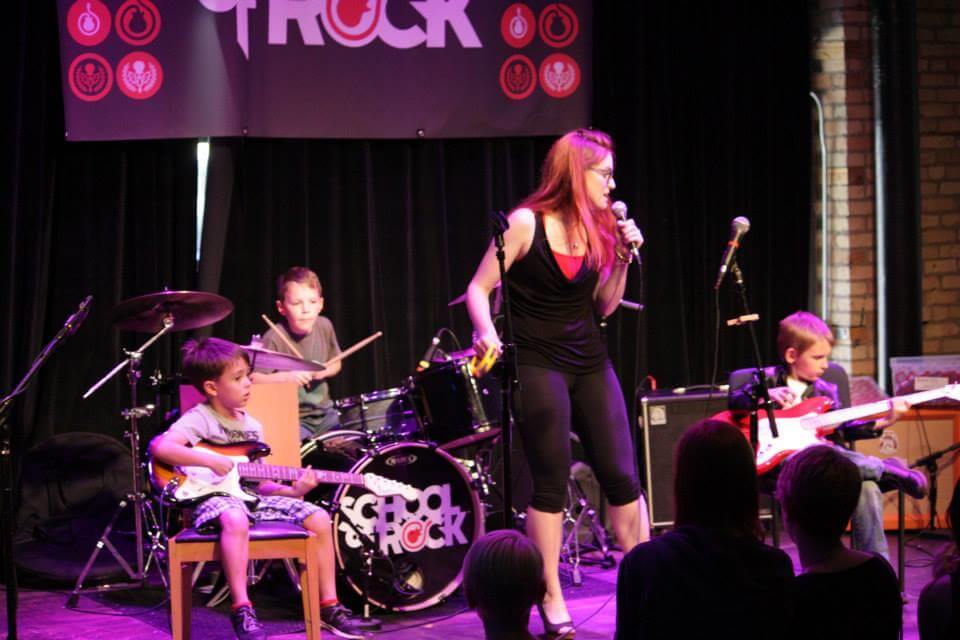 St Paul Rookies perform with their teacher at the School of Rock Mid-Season Show.