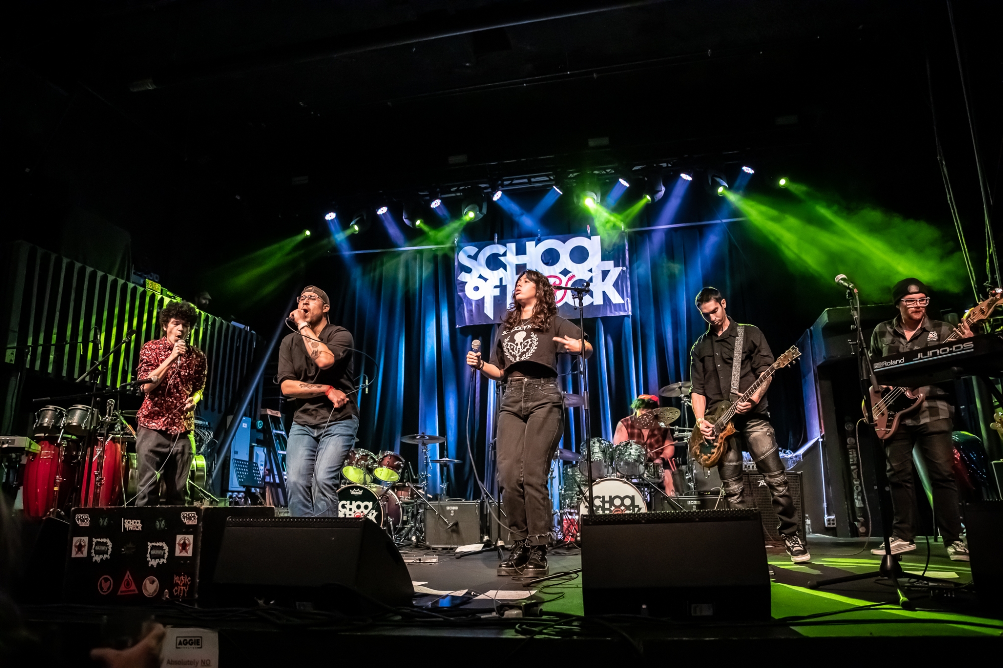 Adult Band students from School of Rock Loveland, the premier Northern Colorado music school offering performance-based music lessons, rocking the stage at The Aggie Theatre!