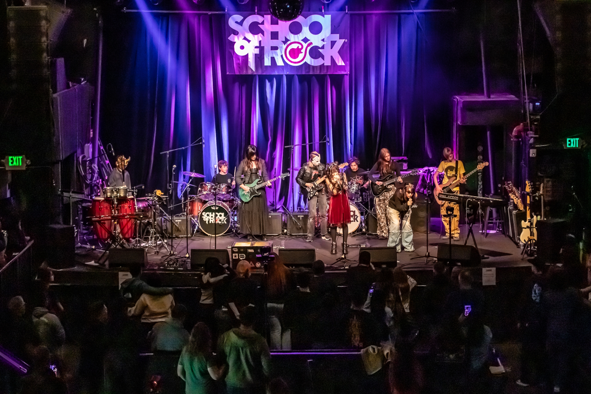 Students at School of Rock Fort Collins and Loveland, premier Northern Colorado music schools offering performance-based music lessons, rocking the stage at The Aggie Theatre!