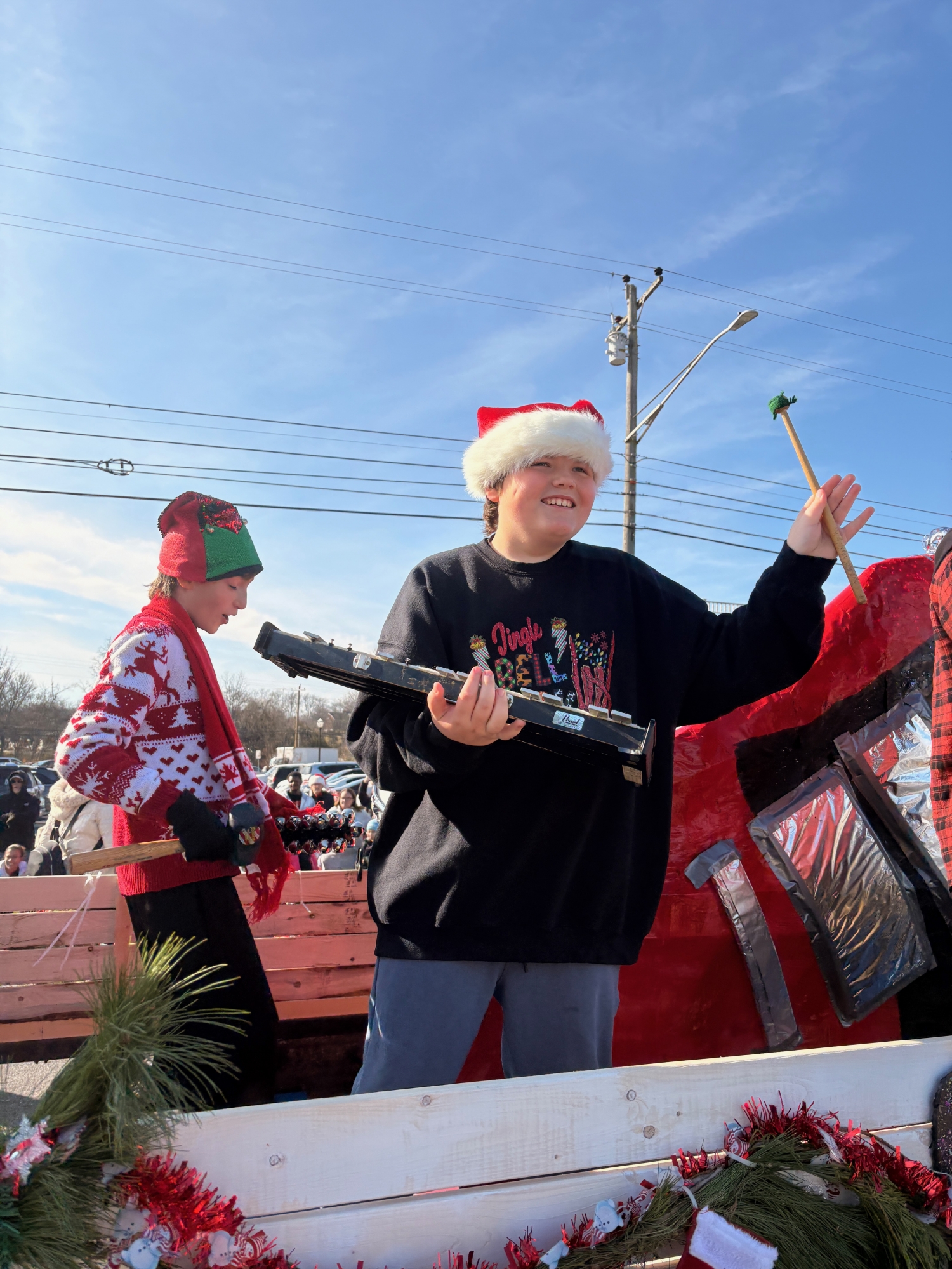 Kian waves to the crowd from our float at the Mt. Juliet Christmas Parade.