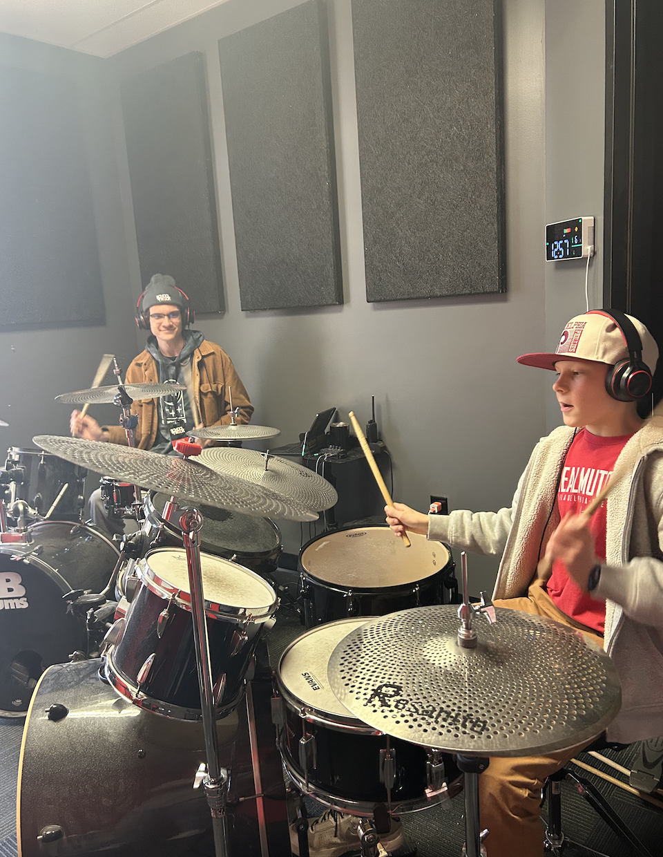 Our student, Michael, in his drum lesson with Cam