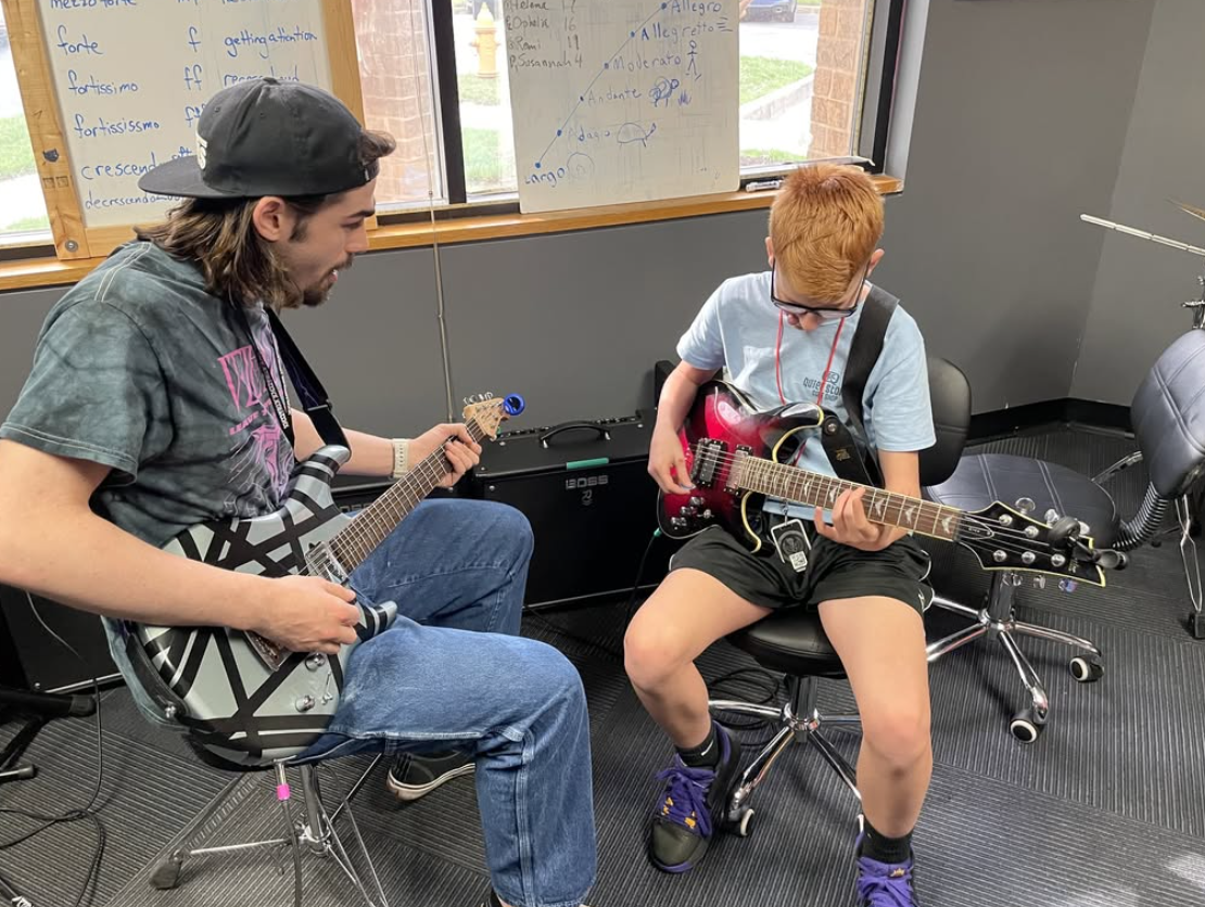 Our student, Garett, in his guitar lesson with Luke