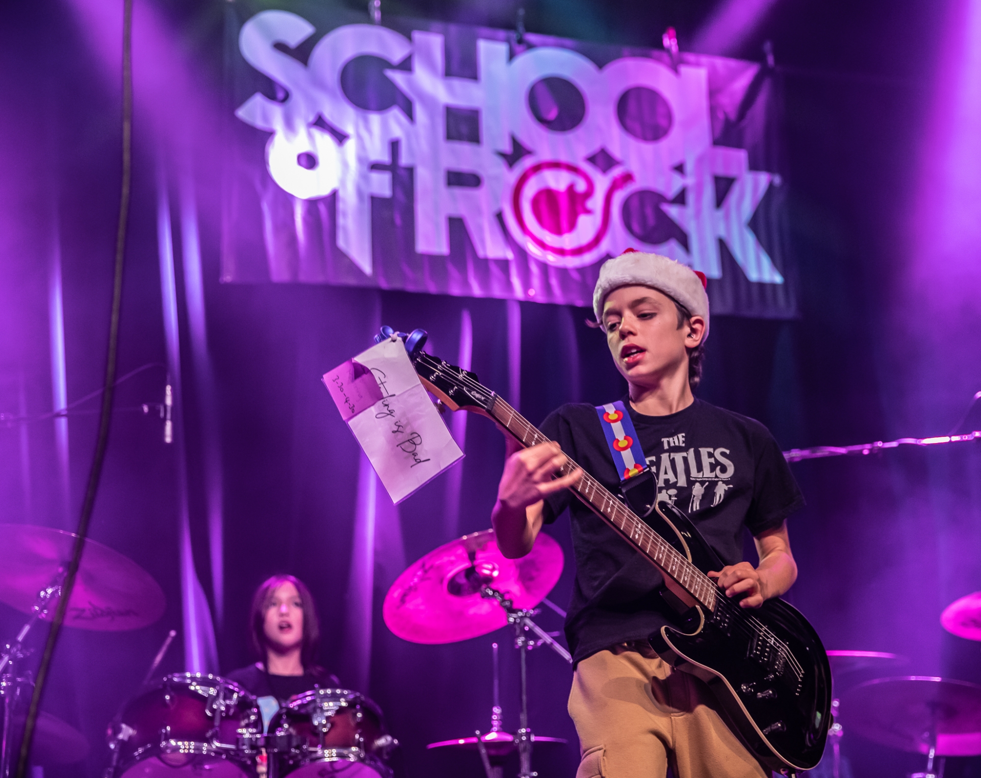 Performance Program student at School from Rock Fort Collins and Loveland, premier Northern Colorado music schools offering performance-based music lessons, rocking the stage at The Aggie Theatre!
