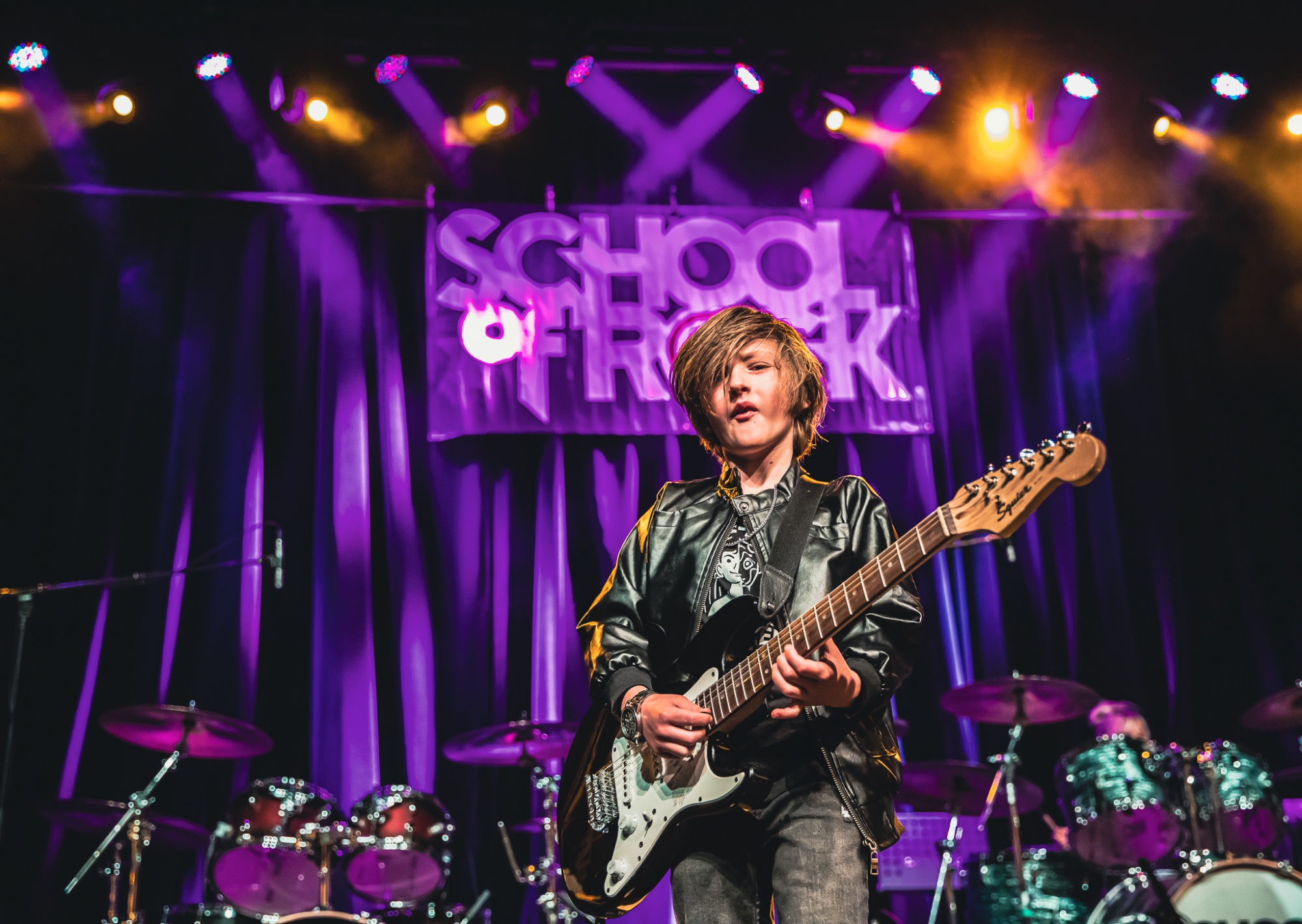 Rock 101 students from School of Rock Loveland, premier Northern Colorado music school offering performance-based music lessons, rocking the stage at The Aggie Theatre!