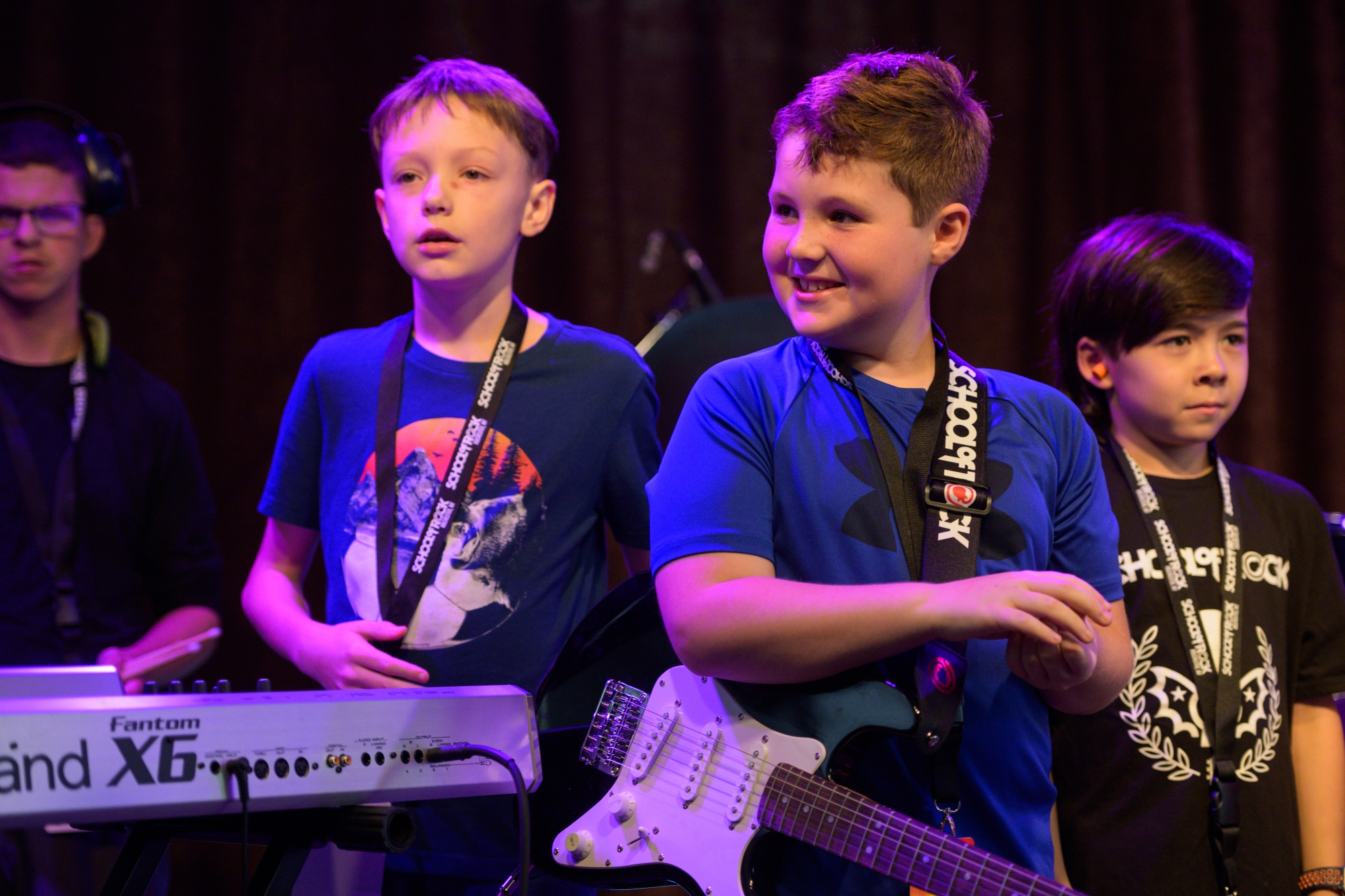 Learn to play live on stage with others at School of Rock.