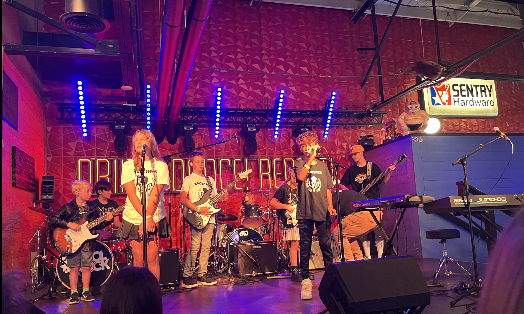 Learn to play live on stage with others at School of Rock.