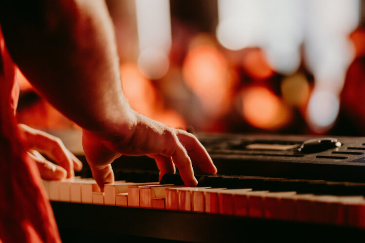 Focused image of a student's hands performing on a keyboard