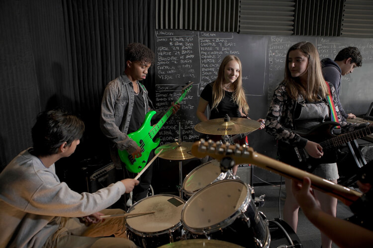 School of Rock students rehearsing