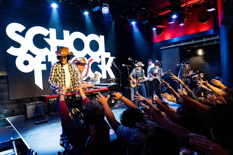 School of Rock Students Performing on Stage