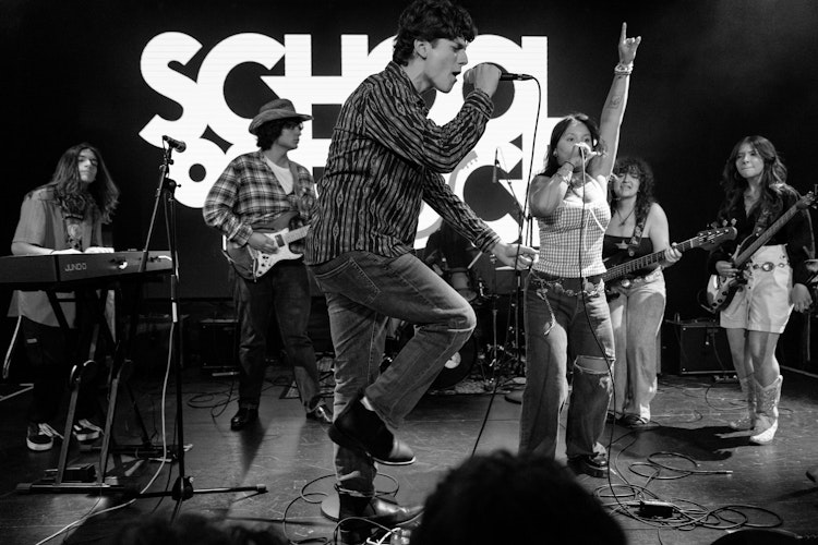 School of Rock Students Performing on Stage