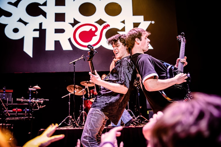 School of Rock students on stage