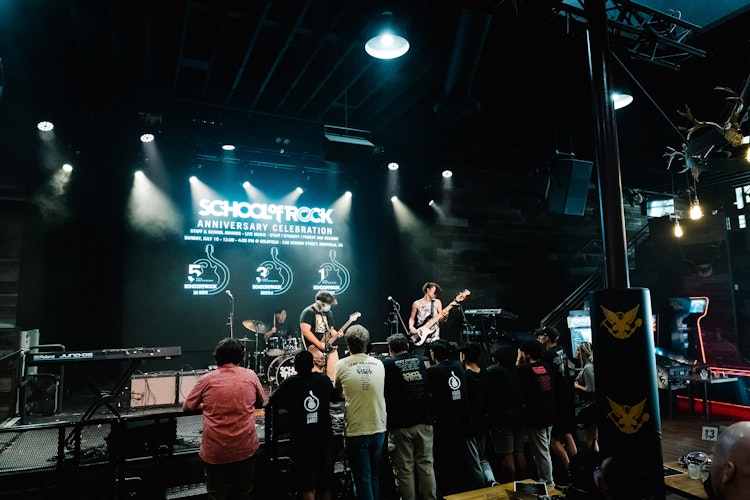 School of Rock Elk Grove students performing on stage