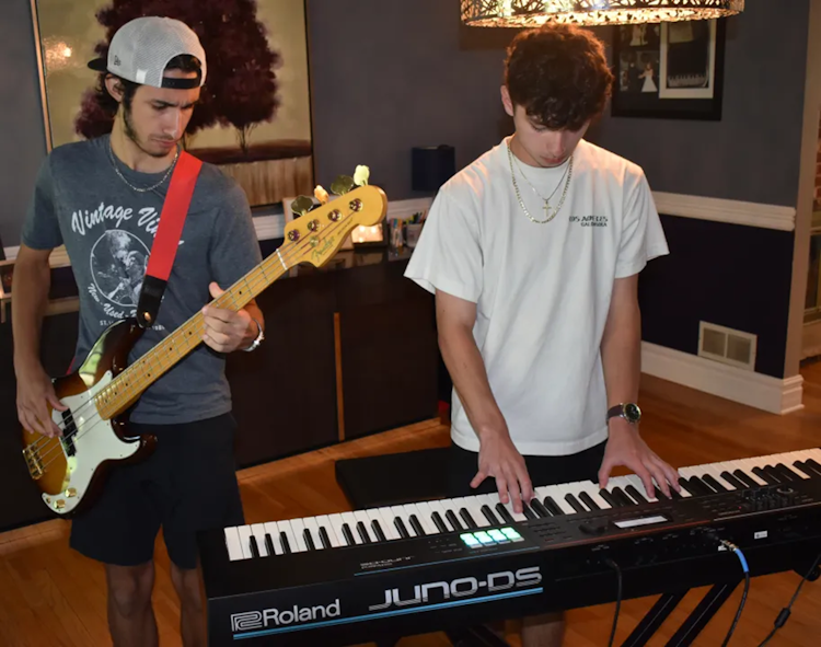 Adam Bodtke, left, and Andrew Russell sneaked in little practice before leaving on their five-city tour with a School of Rock AllStars band. (Steve Metsch/Naperville Sun)