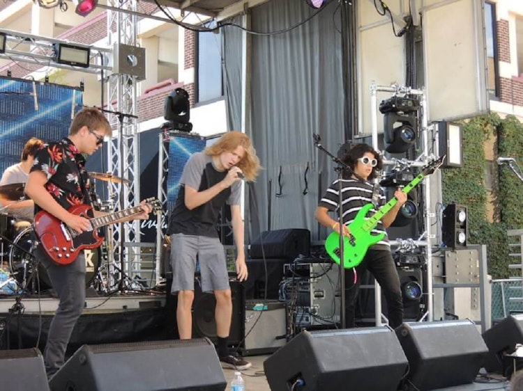 Young musicians from Elmhurst’s School of Rock entertained at Rock the Block. (Graydon Megan / Pioneer Press)