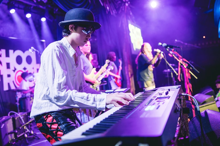 School of Rock Student Performing on Stage