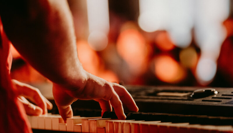 Focused image of a student's hands performing on a keyboard