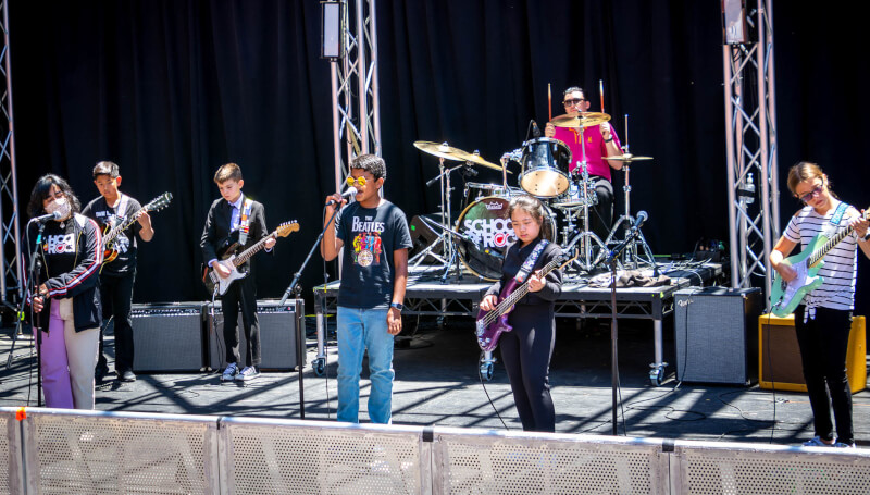 School of Rock Tustin Students perform at the Garden Grove Amphitheater in 2022