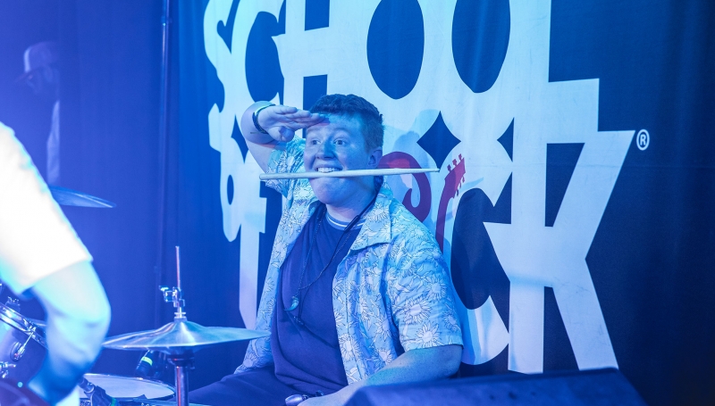 School of Rock student drummer on stage