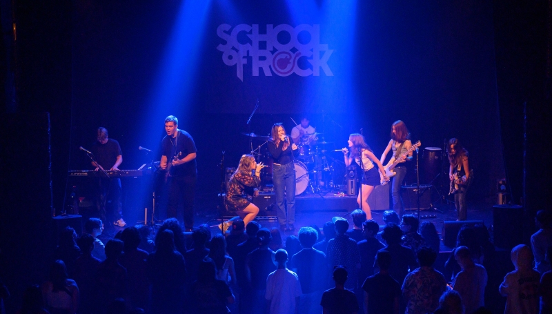 School of Rock students on stage