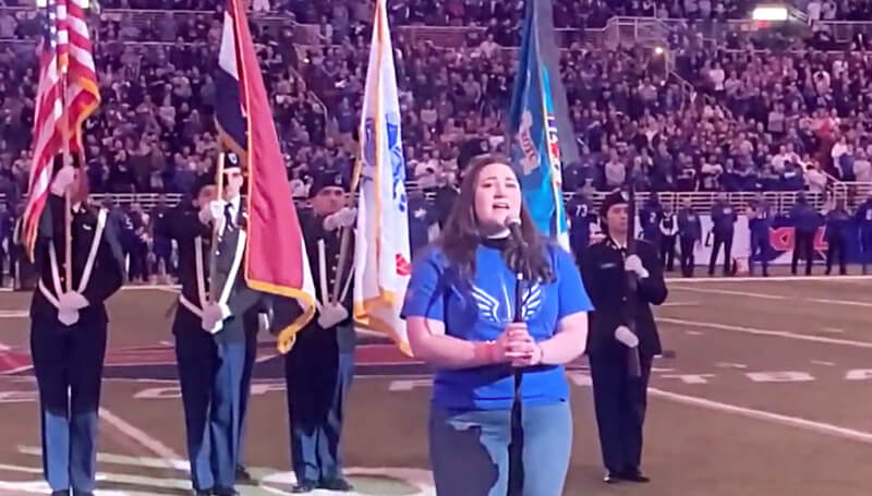 School of Rock student singing National Anthem at XFL game
