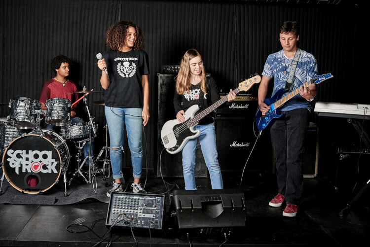 Students playing in the School of Rock House Band